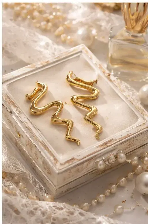 Abstract Gold Tone Wavy Drop Earrings for Women - Image 1